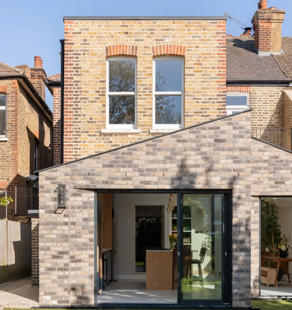 Gable-roofed brick rear extension on a Victorian London house