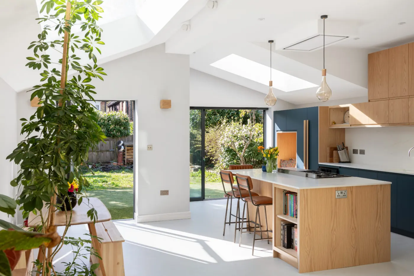 Bright kitchen extension with rooflights, island and garden doors